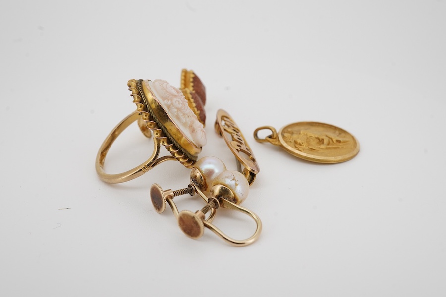 Two pairs of 9ct ear clips including cultured pearl, a 9ct 'Baby' brooch, a 9ct and cameo set ring and a yellow metal pendant, gross weight 14.6 grams. Condition - poor to fair